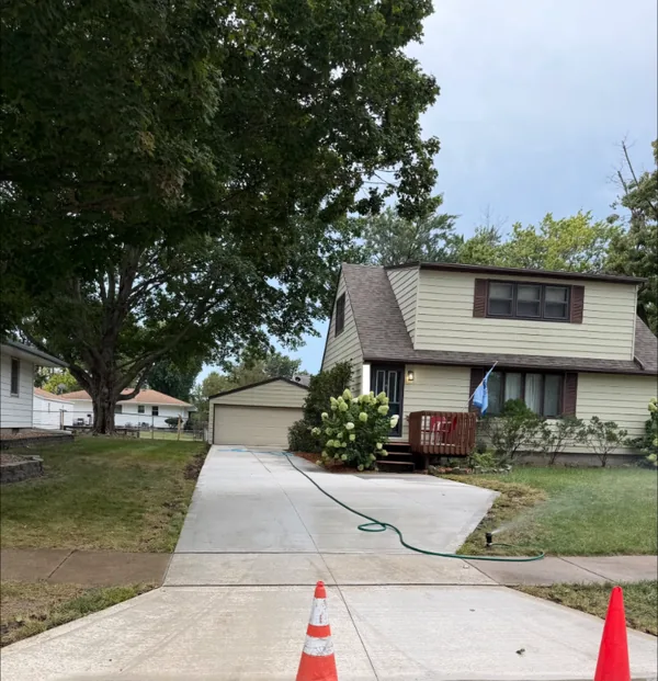New concrete driveway and front walk at a two-story house, Medina Concrete job
