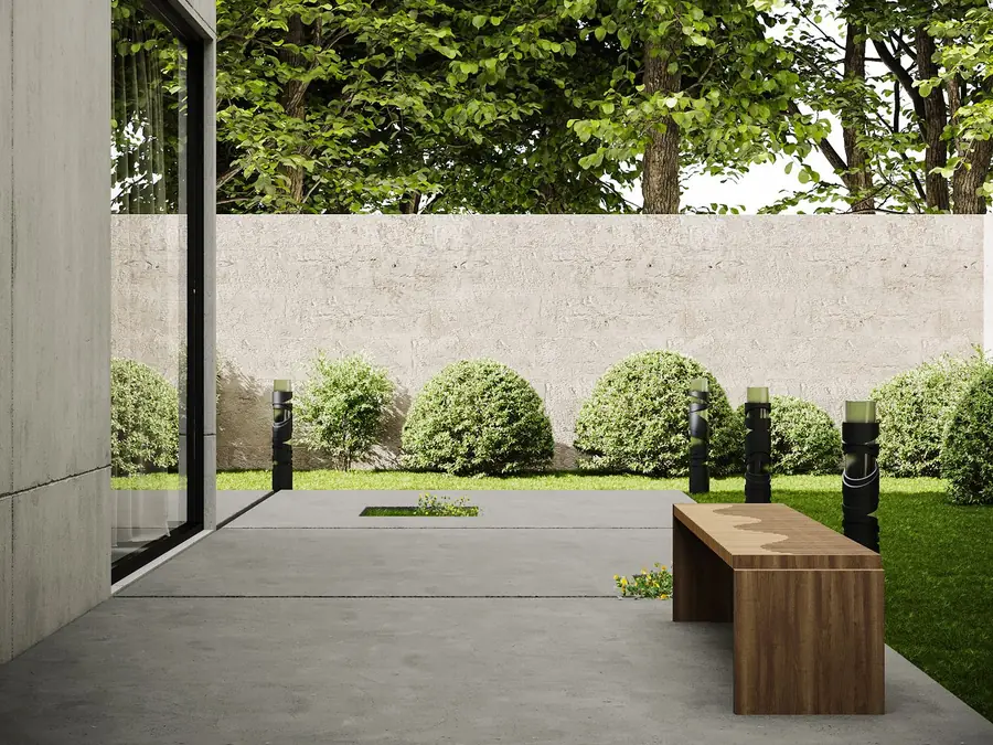 Backyard concrete patio with a wooden bench (stock photo, not a Medina Concrete job)